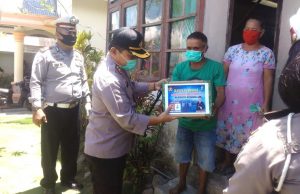 Ringankan Beban warga kurang mampu saat wabah Covid-19, Kapolres Kotamobagu bagikan Sembako