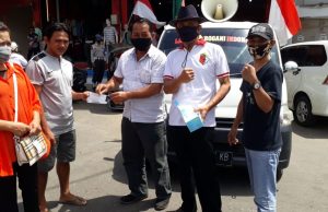 Polres Kotamobagu bersama Ormas Laskar Bogani Indonesia bagi masker dan himbau Prokes Covid-19