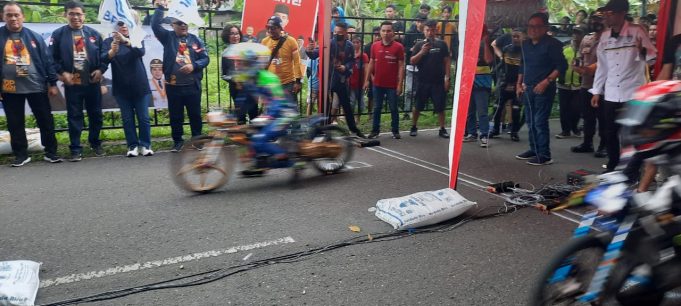 Polres Kotamobagu Amankan Event Drag Bike Dalam Rangka Hari Migran Internasional 2022