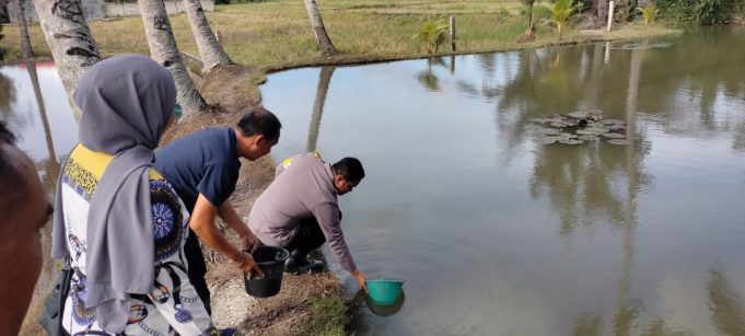 Kapolres Kotamobagu Lakukan Pelepasan Benih Ikan Nila Kelompok Budidaya Ikan Bhayangkara